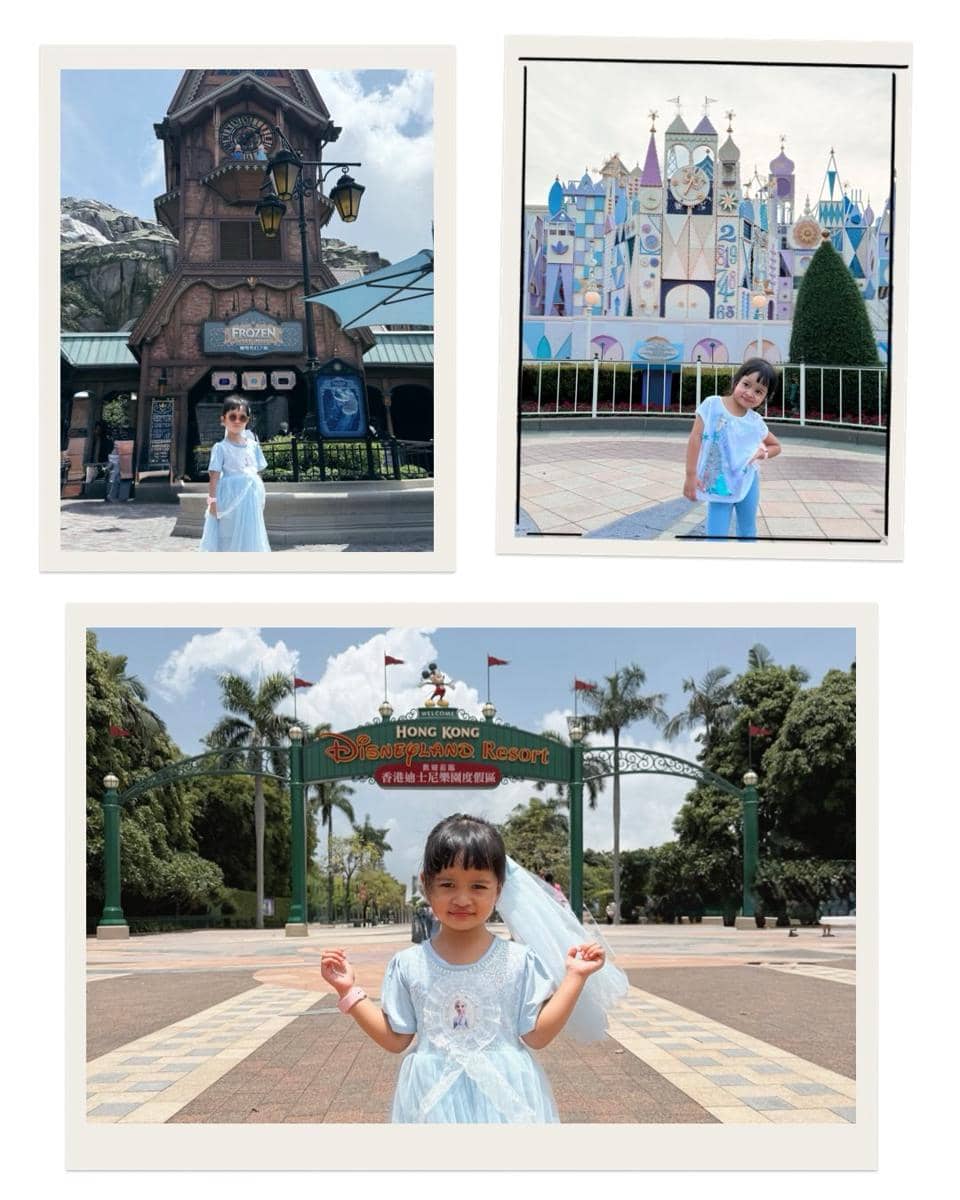 Seorang anak kecil mengenakan gaun biru bergaya putri berpose di berbagai area Disneyland Hong Kong, termasuk gerbang utama taman hiburan.