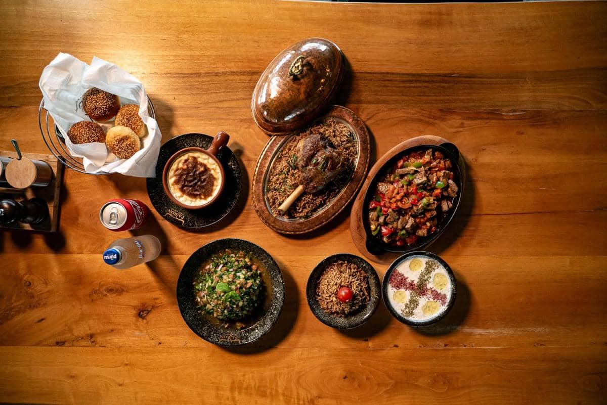 https://www.pexels.com/photo/delicious-middle-eastern-feast-on-wooden-table-36984987/