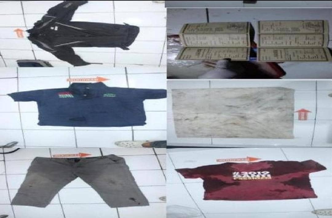 Barang bukti berupa beberapa potong pakaian, celana, kain, dan dokumen yang disita polisi di Polresta Banyumas.