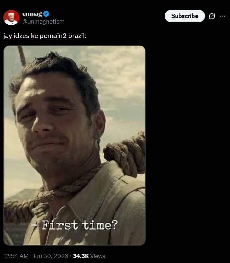 Cuplikan adegan film menampilkan seorang pria dengan tali di lehernya tersenyum dengan teks 'First time?' di bagian bawah.