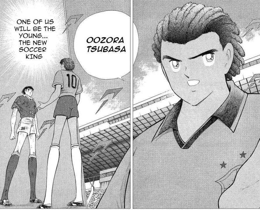 Dua pemain sepak bola muda dari manga Captain Tsubasa: World Youth berdiri di lapangan stadion dengan ekspresi penuh tekad.
