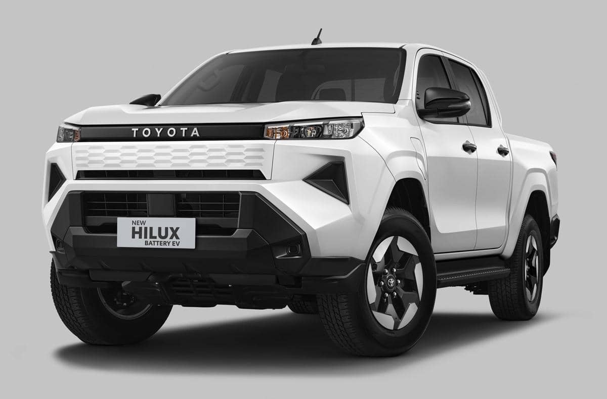 Toyota Hilux BEV berwarna putih dengan desain modern dan gagah, menampilkan gril depan tertutup khas kendaraan listrik.