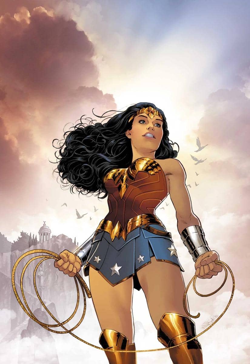 Ilustrasi karakter Wonder Woman mengenakan kostum merah, biru, dan emas sambil memegang tali laso emas di bawah langit berawan.