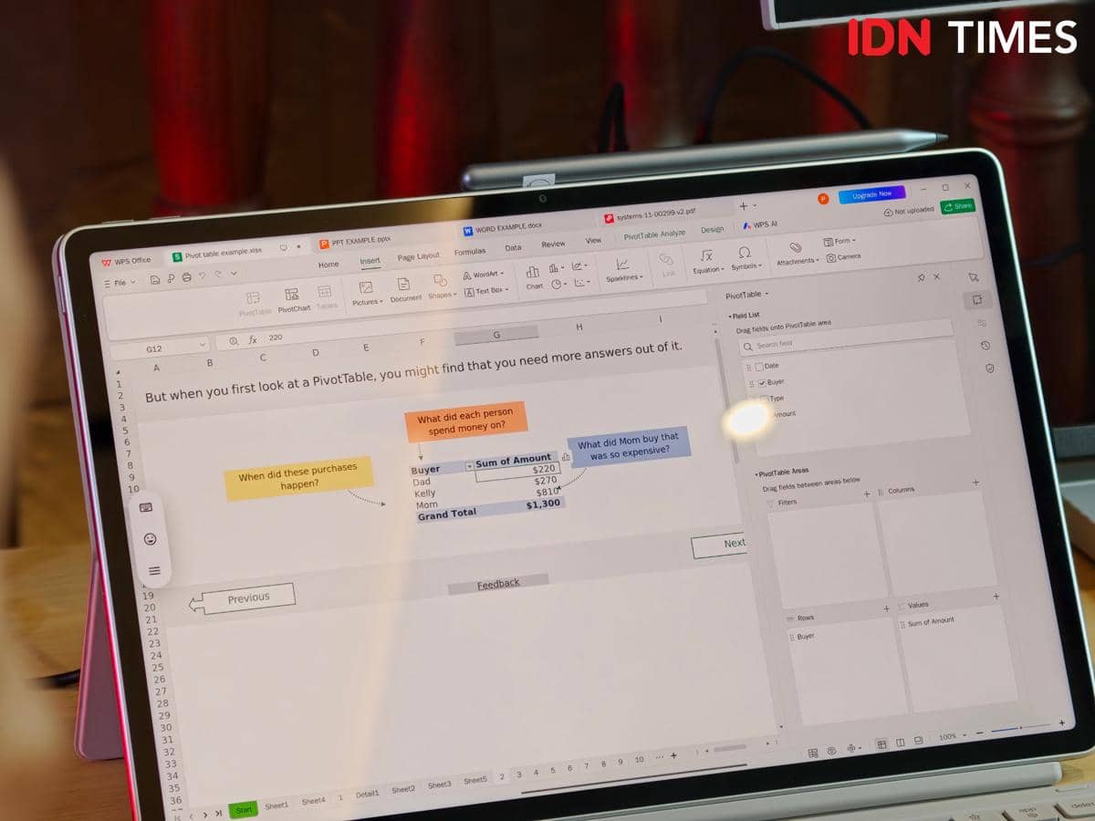 Tablet Lenovo Idea Tab Gen 2 menampilkan layar dengan aplikasi spreadsheet terbuka yang memperlihatkan tabel pivot dan data keuangan.