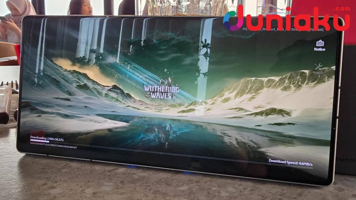 Layar smartphone REDMAGIC 11S Pro menampilkan proses unduhan game Wuthering Waves di atas meja kafe dengan latar orang berbincang.