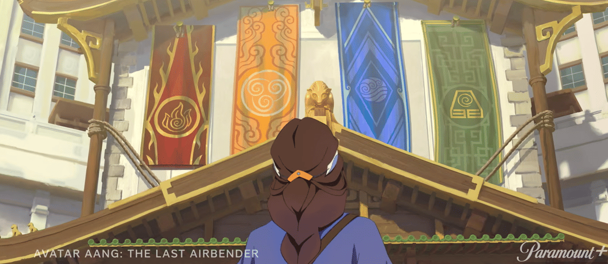 Katara berdiri menghadap bangunan besar dengan empat spanduk elemen di dinding, diduga berada di Republic City dari Avatar Aang: The Last Airbender.