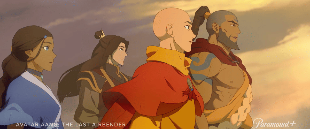Avatar Aang dewasa bersama tiga rekannya berdiri menghadap cakrawala saat matahari terbenam dengan latar langit berwarna keemasan.