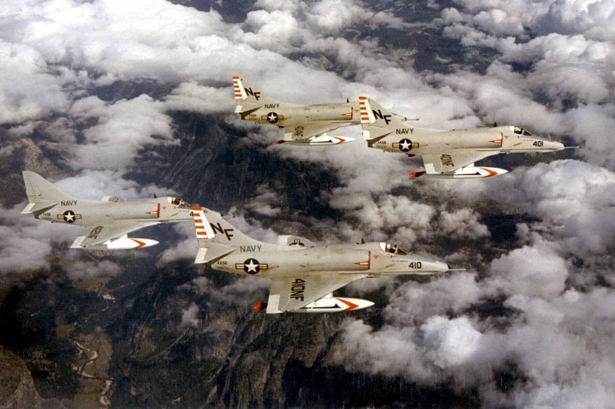 Empat pesawat Douglas A-4E Skyhawk Angkatan Laut AS sedang terbang. Menerbangkan A-4E, VA-56 ditugaskan ke Sayap Udara Kapal Induk 5 (CVW-5) di atas kapal induk USS Ticonderoga (CVA-14) dari tahun 1964 hingga 1966.