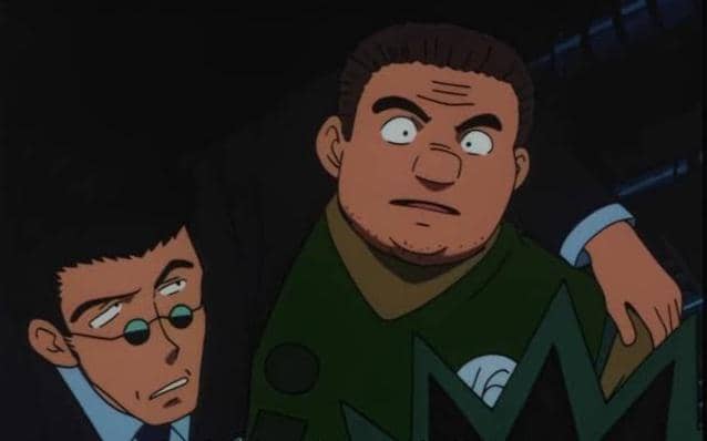 Leorio dan Tonpa dari anime Hunter x Hunter sedang berdiri berdekatan dengan ekspresi serius di latar gelap.