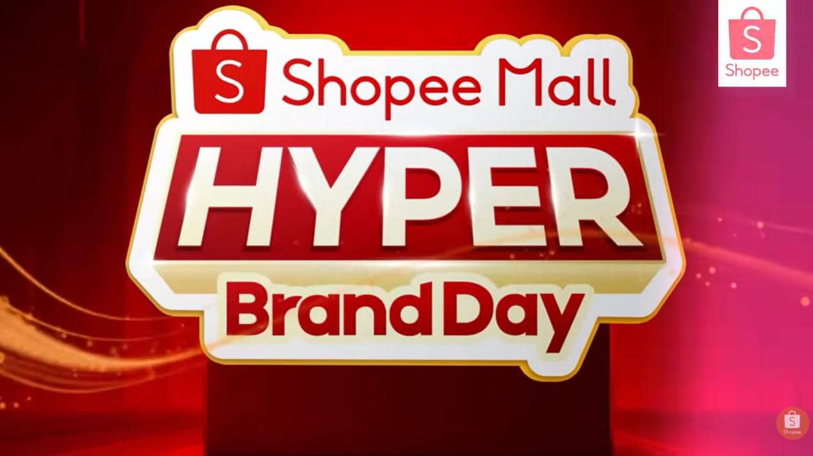 Logo promosi Shopee Mall Hyper Brand Day dengan latar belakang merah dan elemen desain berwarna emas serta putih.