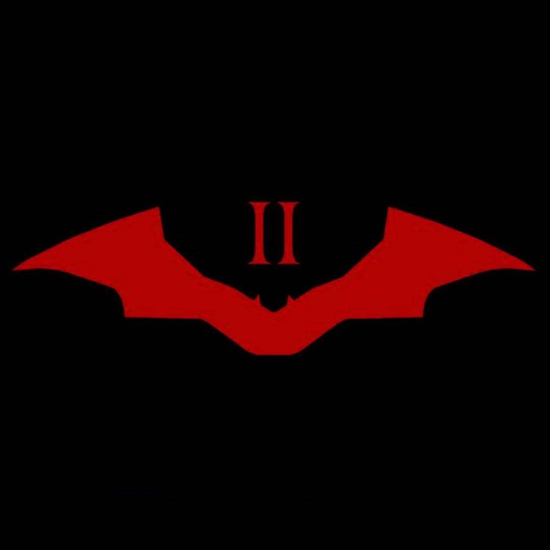 Logo kelelawar berwarna merah dengan angka Romawi II di tengahnya pada latar hitam sebagai teaser film The Batman Part 2.