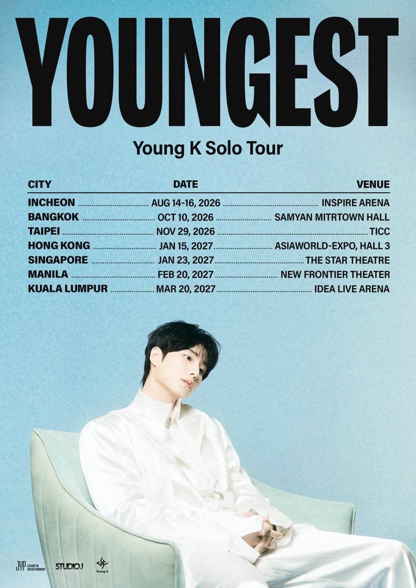 Poster tur solo Young K bertajuk YOUNGEST dengan jadwal konser di berbagai kota Asia dan foto artis duduk mengenakan pakaian putih.