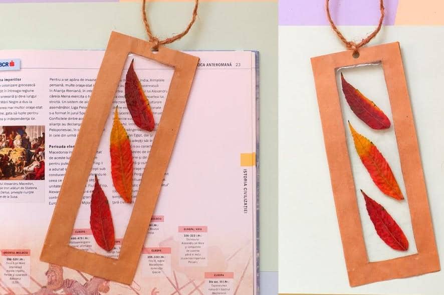 ilustrasi pembatas buku dari kertas dan daun kering