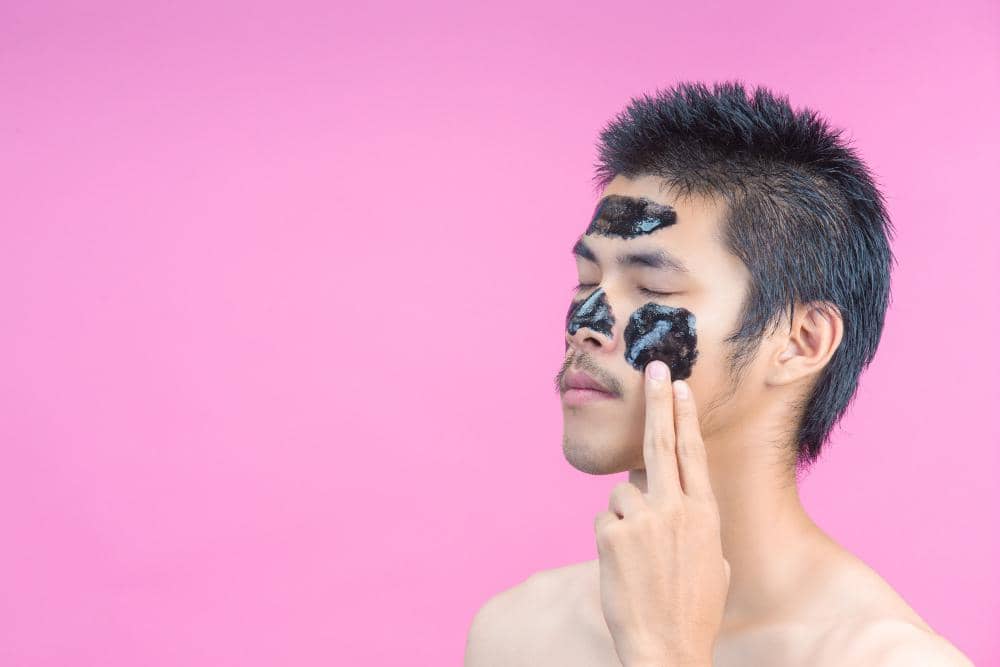 ilustrasi pria mengenakan masker jerawat.