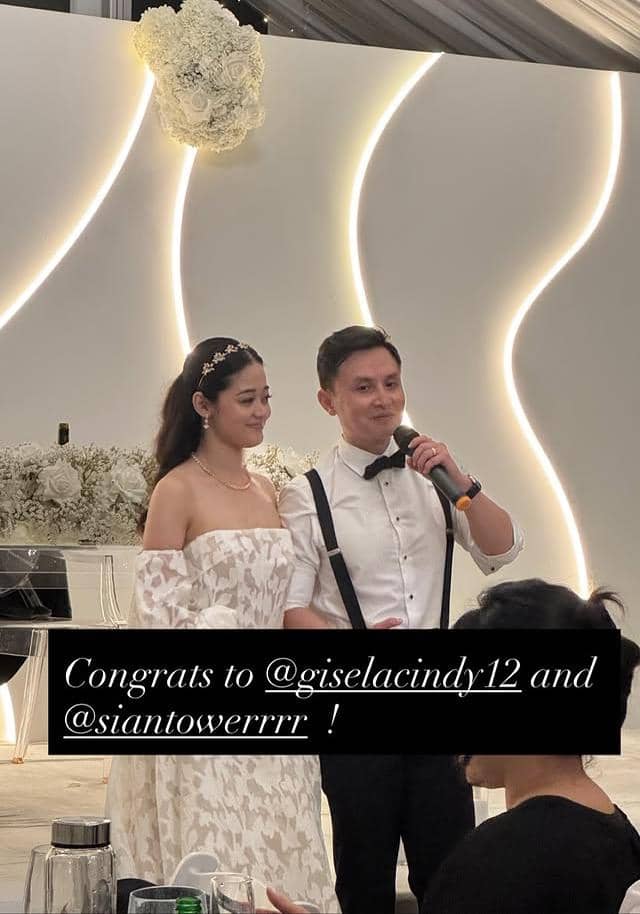 Gisela Cindy dan pasangannya berpose dalam potret pernikahan, mengenakan busana pengantin di hari bahagia mereka.