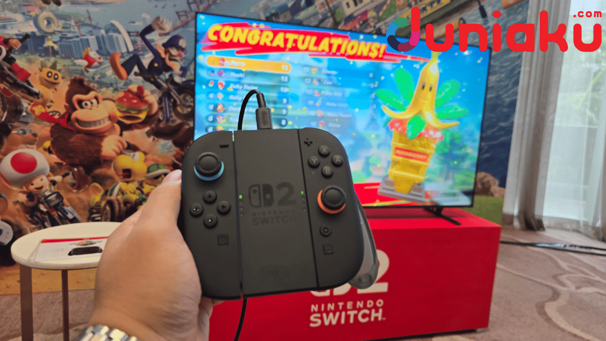 Visual Mario Kart World, permainan balap kart dengan karakter Nintendo dan lintasan berwarna-warni di layar.