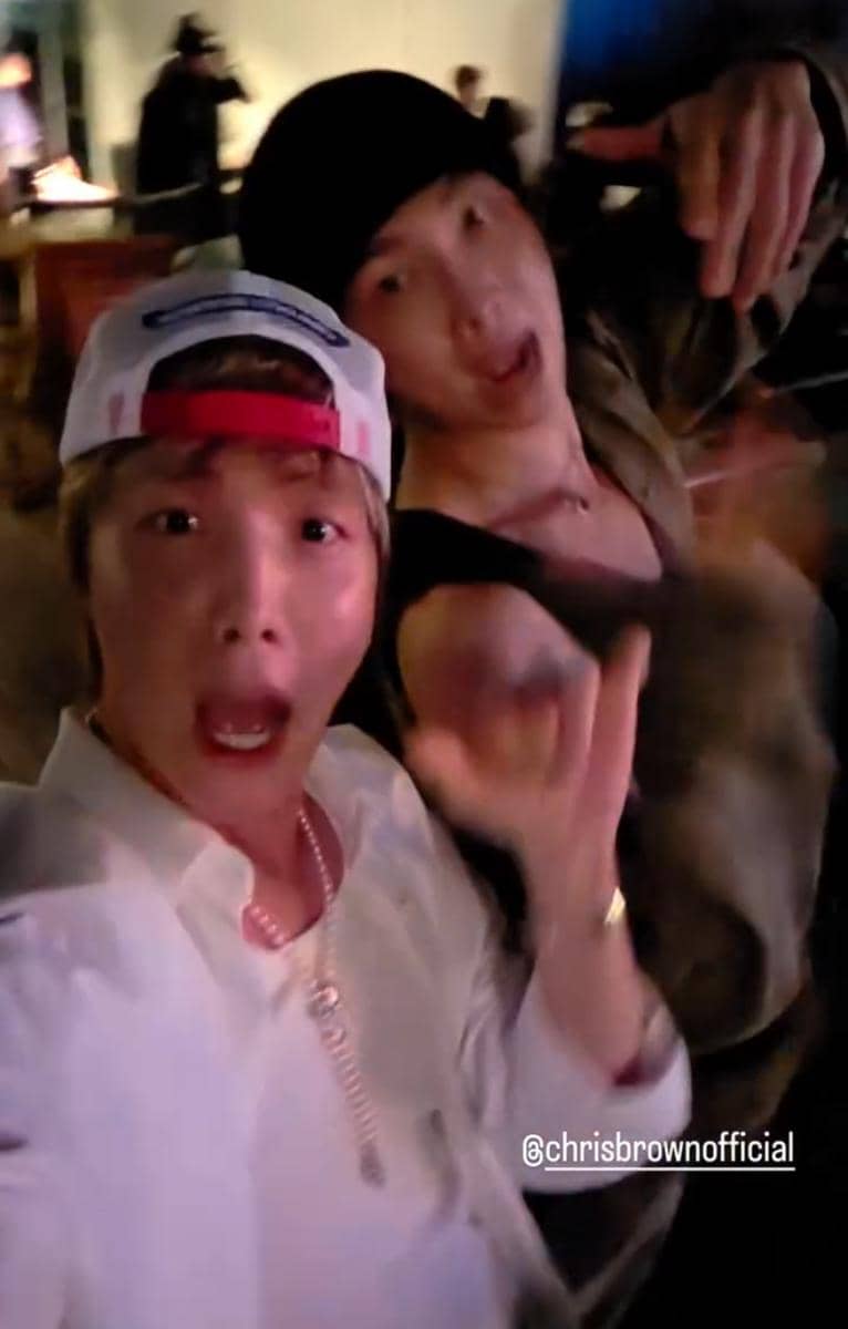 J-Hope dan RM BTS menikmati konser Usher dan Chris Brown dalam potret unggahan Instagram mereka.