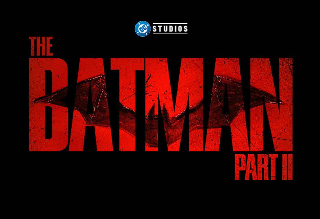 Logo The Batman: Part II berlatar hitam dengan judul berwarna merah tua dan lambang kelelawar pada desainnya.