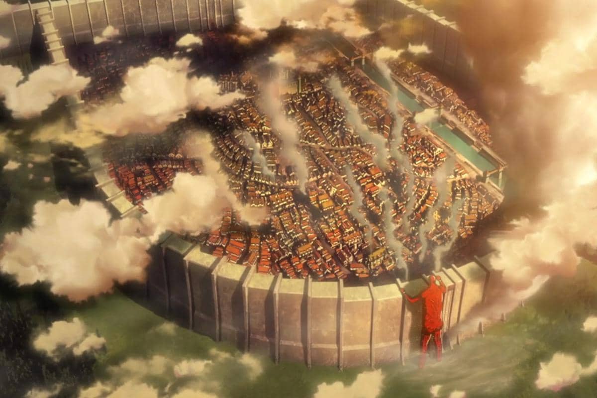 Colossal Titan menghancurkan gerbang masuk Tembok Maria dalam adegan anime Attack on Titan karya WIT Studio.